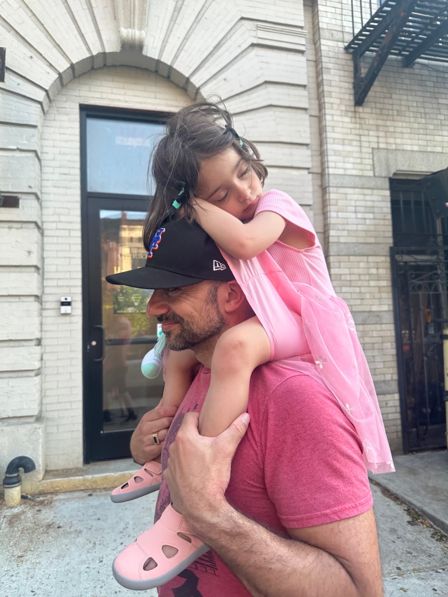 Charlie O'Donnell with his daughter outside his building